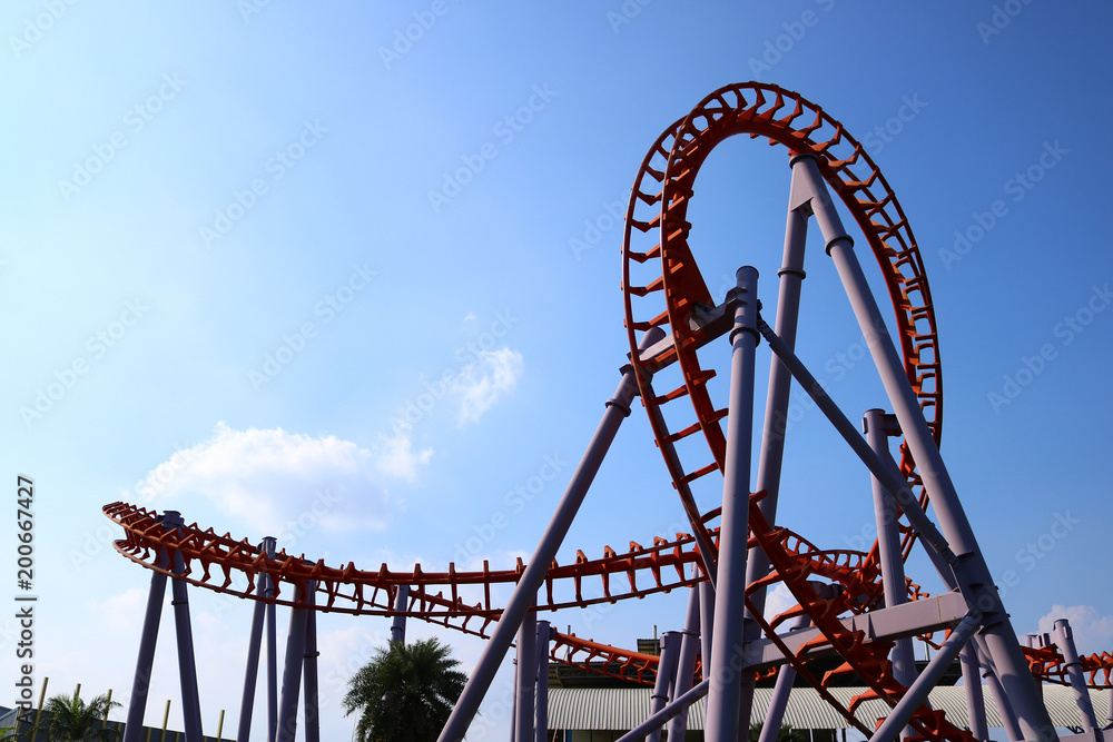 roller coaster with blue sky roller coaster with blue sky