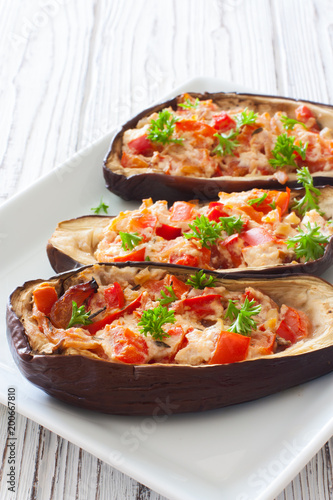 Eggplants stuffed with tomatoes , sweet peppers and ricotta