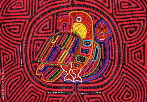 Cuna Mola panel with bird motif.  The panels are made using the reverse appliqué technique to expose colorful underling layers, San Blas Islands, Panama photo