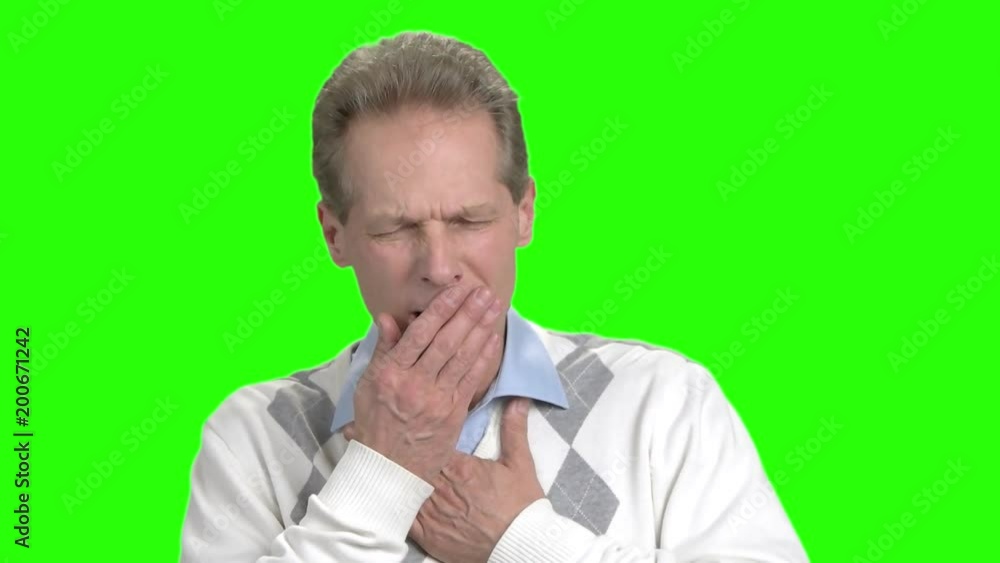 Man having cough attack, green background. Mature man suffering from cough on chroma key background. Allergy or asthma symptoms. Man having cough attack, green background. Mature man suffering from cough on chroma key background. Allergy or asthma symptoms.