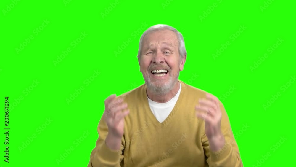 Desperate elderly man gesturing with hands. Stressed and troubled old man screaming on chroma key background, slow motion. Human facial expressions. Desperate elderly man gesturing with hands. Stressed and troubled old man screaming on chroma key background, slow motion. Human facial expressions.