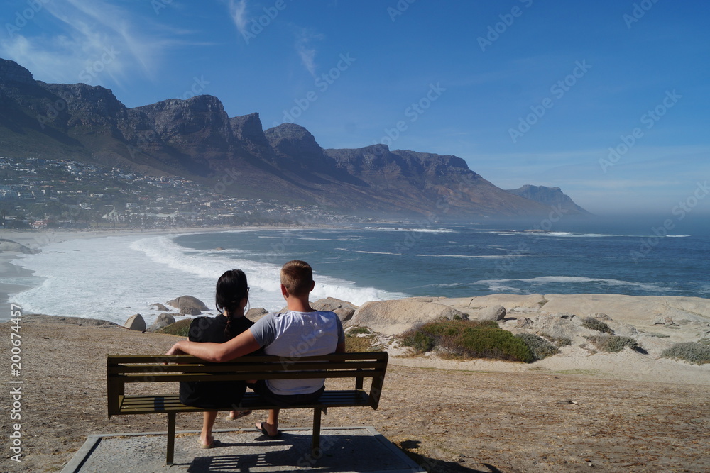 Couple overlooking Camps Bay and the Twelve Apostles, South Africa