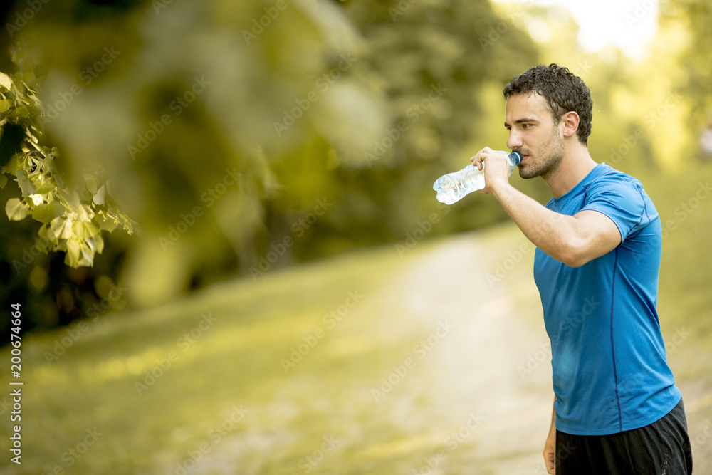 Young man drinking water