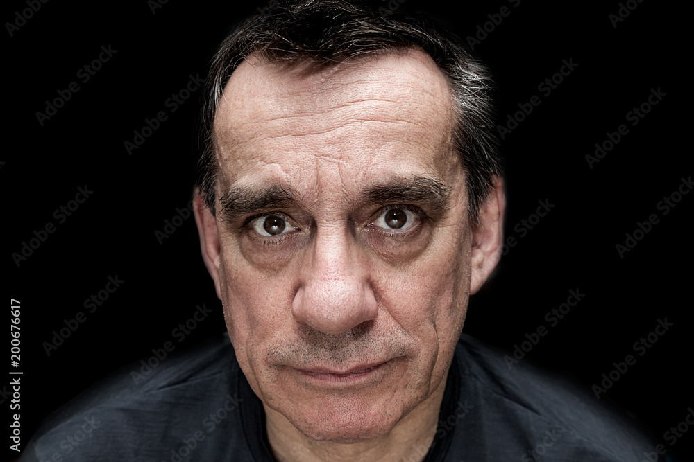 Dramatic portrait of sad unhappy looking man Dramatic portrait of sad unhappy looking man