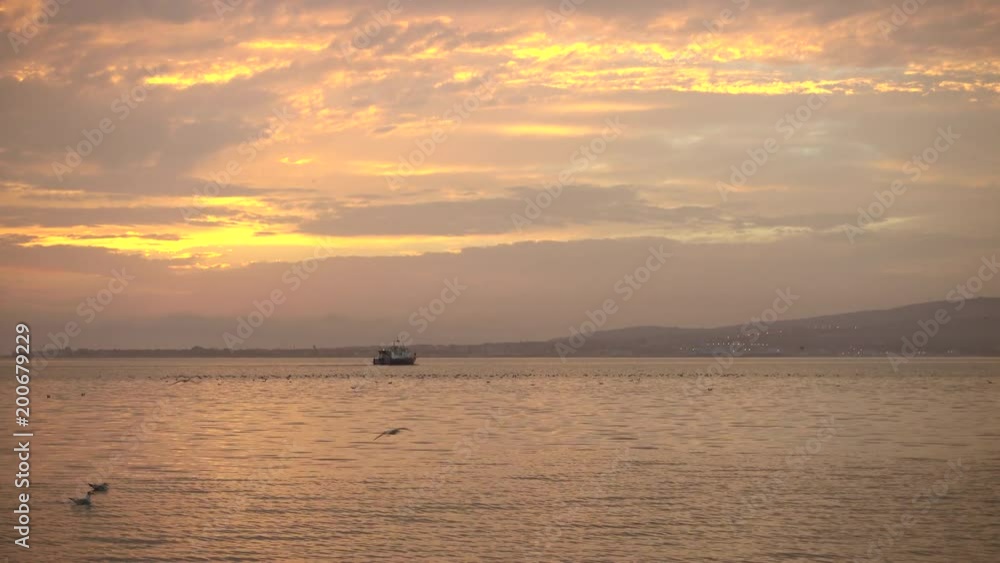 Beautiful lake and white boat floats away into distance. Beautiful lake and white boat floats away into distance.
