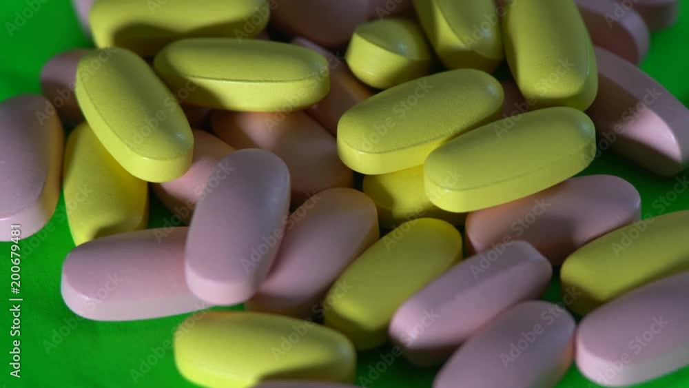 pills rotate on green background. pills rotate on green background.