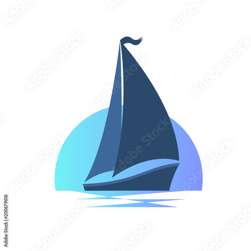 Sailing boat on the waves at sunset.