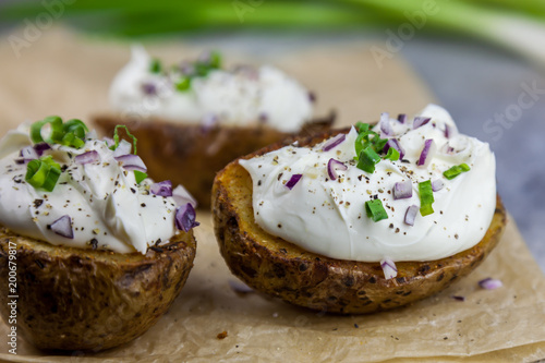 Baked jacket potatoes stuffed with curd and spring onion