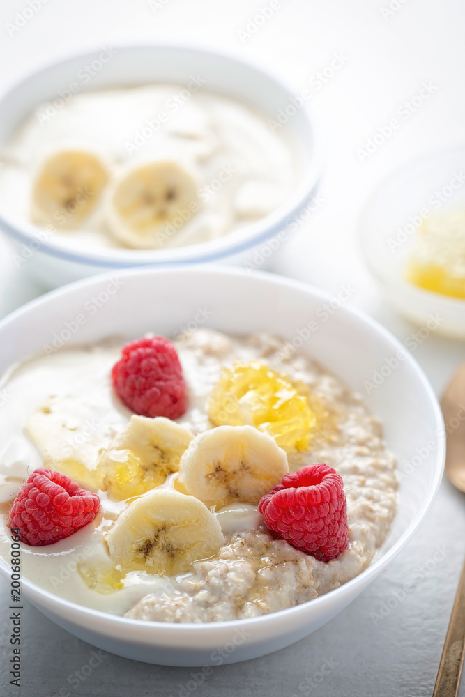 Porridge with banana yoghurt, banana, raspberries and honey Porridge with banana yoghurt, banana, raspberries and honey