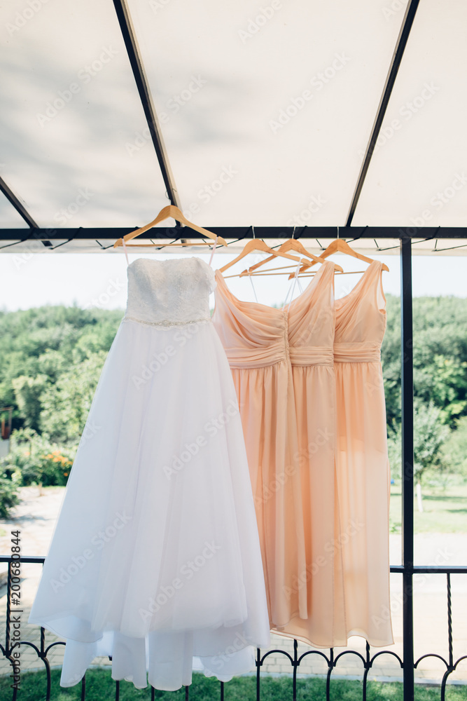 Dress for the bride hanging on hangers Stock Photo | Adobe Stock