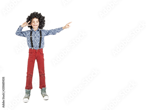 Little boy pointing empty copy space. Isolated on white background