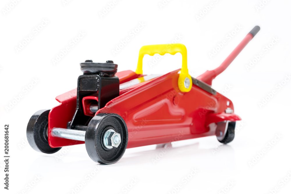 Red hydraulic floor jack isolated on white background Red hydraulic floor jack isolated on white background