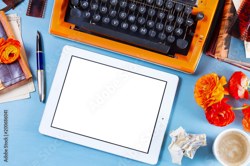 Workspace with vintage orange typewriter photo