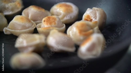 Frying dumplings in slow motion photo