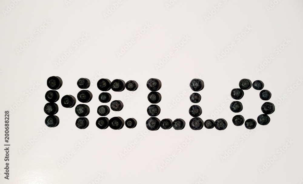 Hello sign word letters writing from blueberries on white background Hello sign word letters writing from blueberries on white background
