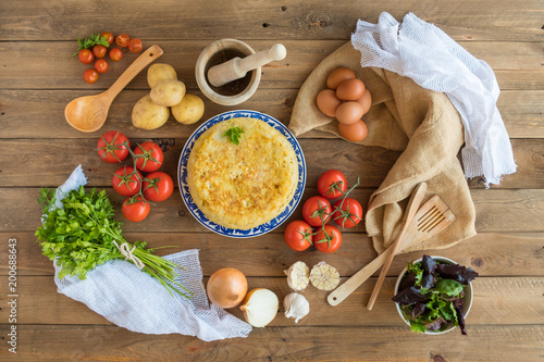 Traditional spanish omelette close up, view from above. Spanish tortilla pincho on a rustic wooden texture