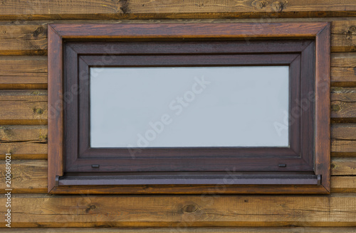 Type of a window of the wooden house which is built in a wall 