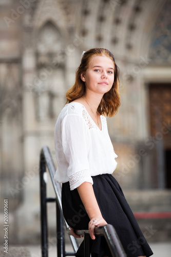 young female on handrail and the stone stairs