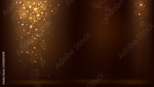 Dark background with light rays and falling golden sparkles, shimmering dust