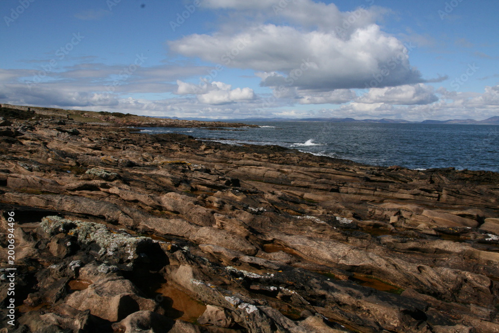 Obraz premium Coastline at Tarbat Ness Lighthouse, Scottish Highlands, Dornach Firth, Scotland