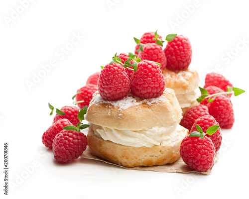 Traditional scones with raspberry and cream isolated on white