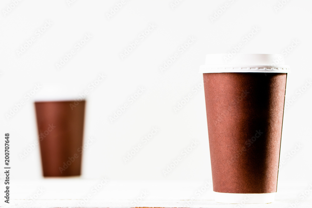 Coffee cup isolated. Brown cups with lid on white background. Coffee cup isolated. Brown cups with lid on white background.