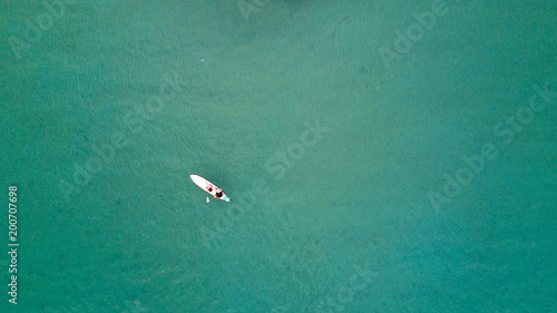 Couple honeymoon kayaking on ocean