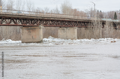 Ice drift. The ice has started on the river. The ice is swimming on the river.