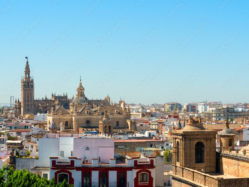 Fototapeta premium The skyline of downtown Seville, beautiful view of the El Divino Salvador Church and Catedral de Sevilla