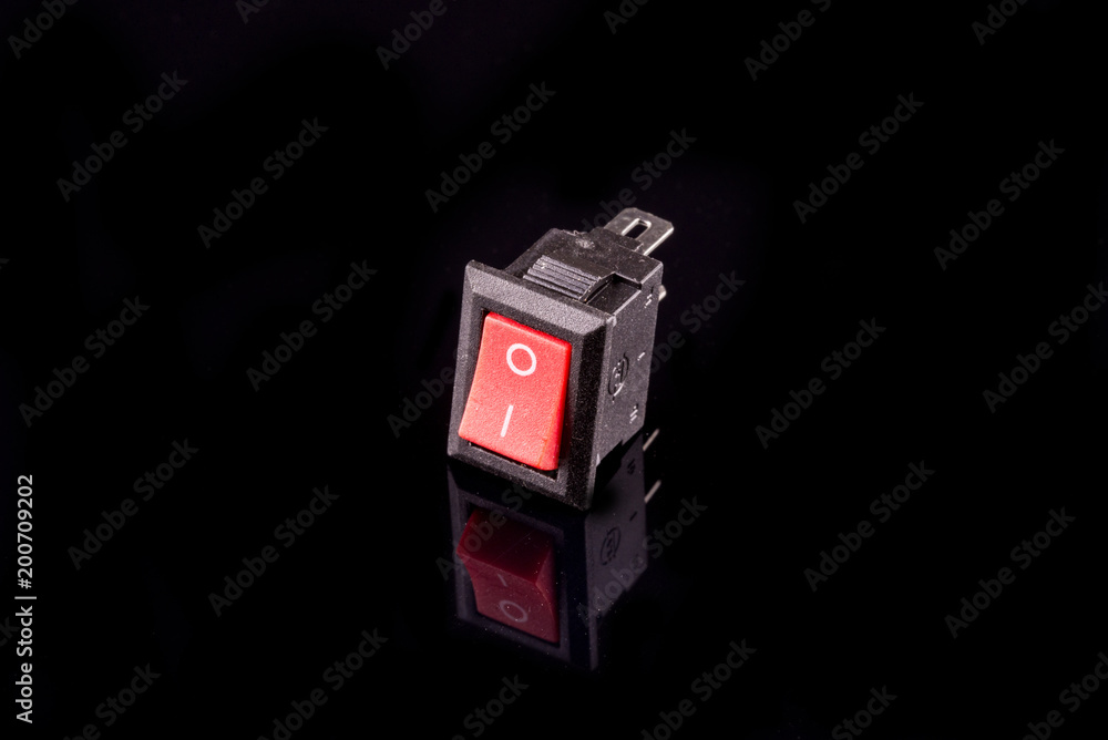 One button on/off on black background One button on/off on black background