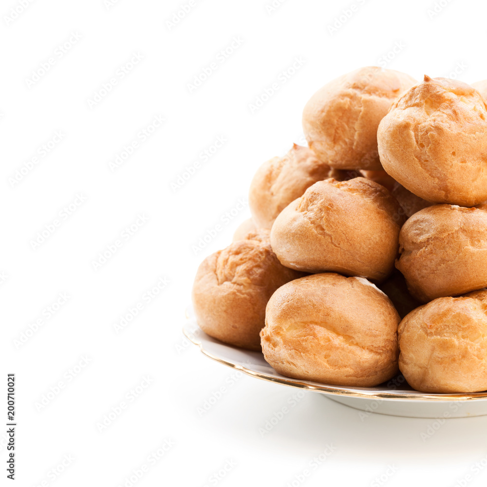 Homemade profiteroles isolated on white Homemade profiteroles isolated on white