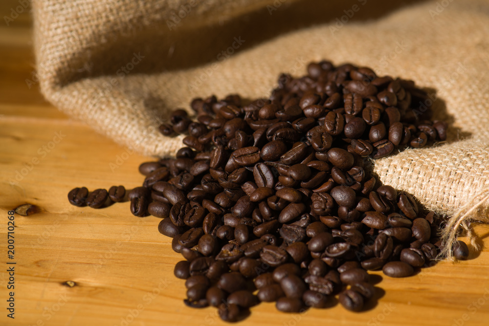 Fresh Roasted Coffee beans on wooden background. Fresh Roasted Coffee beans on wooden background.