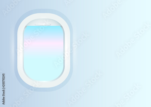 Window of an airplane with a blue sky.Blue background with a window