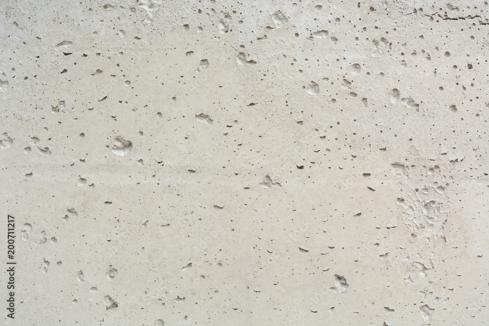 Texture of concrete. Porous concrete background. Concrete background with bubbles. Uneven concrete surface background. Texture of concrete. Porous concrete background. Concrete background with bubbles. Uneven concrete surface background.