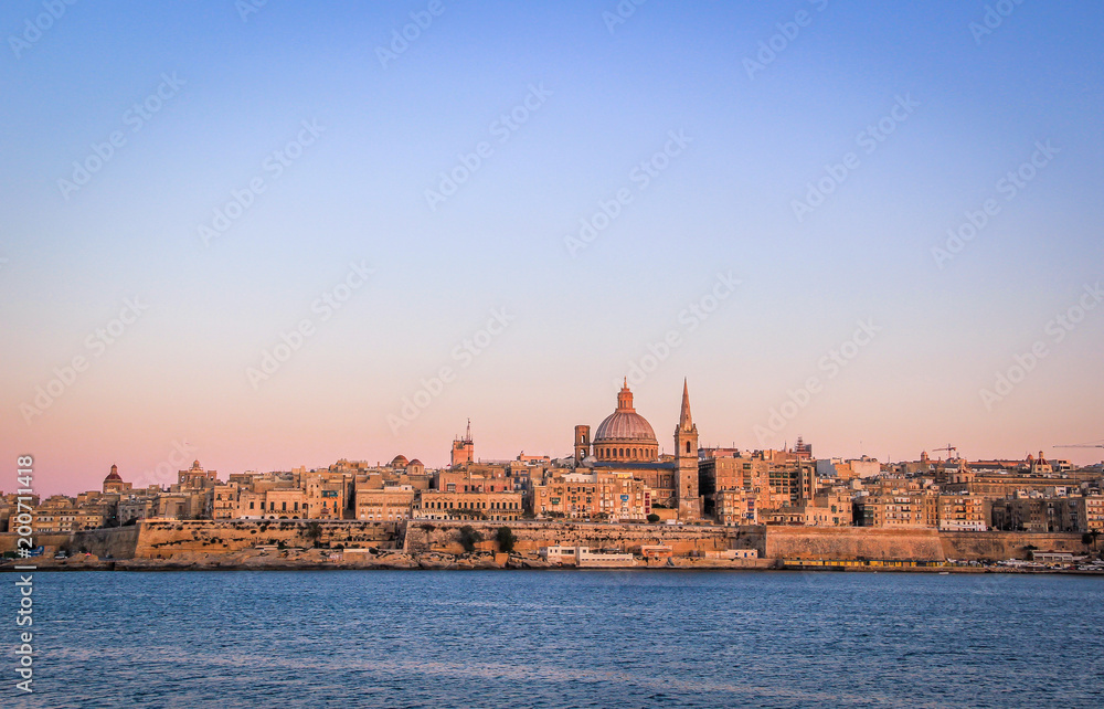Valletta skyline at Sunset, dominated by the dome of the Shrine of Our Lady of Mount Carmel, Malta.