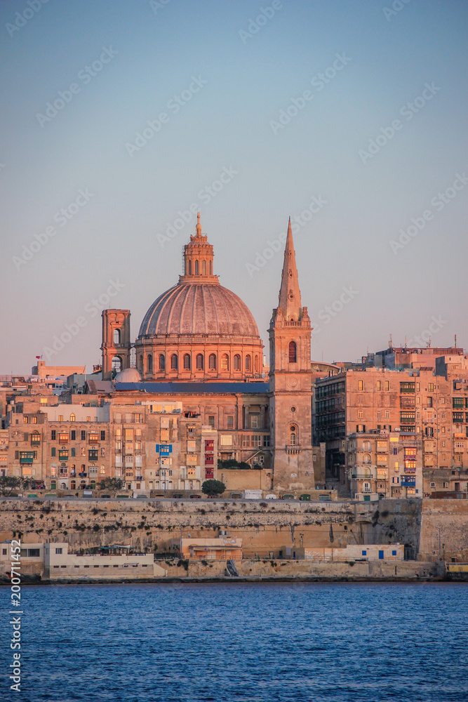 Valletta skyline at Sunset, dominated by the dome of the Shrine of Our Lady of Mount Carmel, Malta.