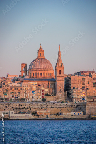 Valletta skyline at Sunset, dominated by the dome of the Shrine of Our Lady of Mount Carmel, Malta. © Christian