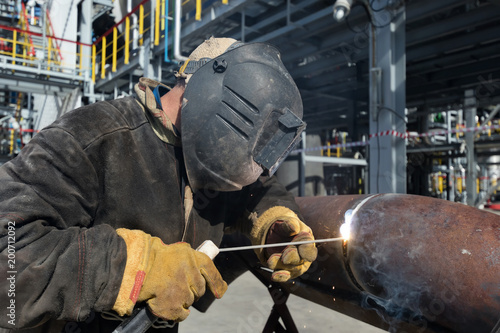 Welding works at installation of new pipeline