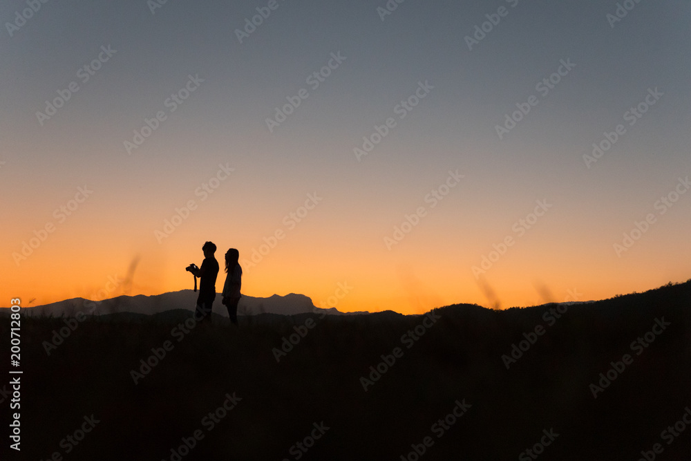 Silhouette of people before sunset
