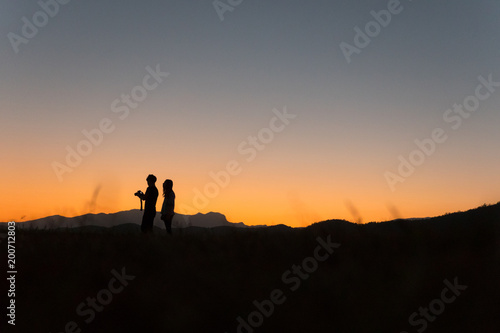 Silhouette of people before sunset 