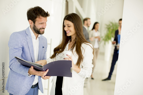 Young couple discussing about business in a modern office