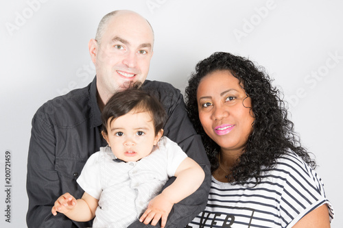 black Mother and father Happy multiethnic family with children son and looking at camera