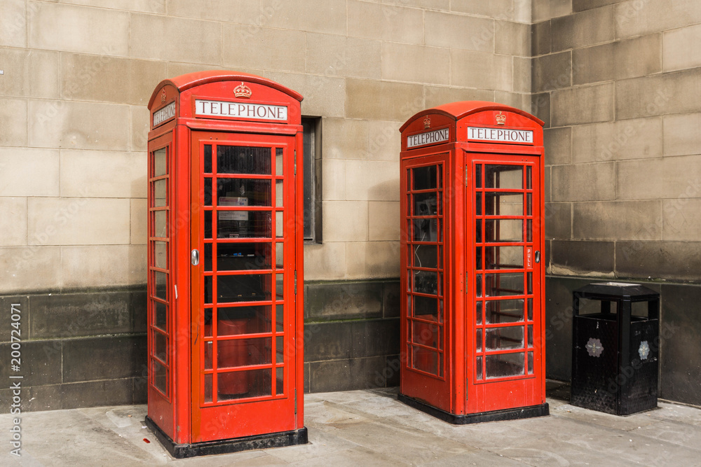 Fototapeta premium British red telephone boxes. The iconic and classic british image of red phone boxes.
