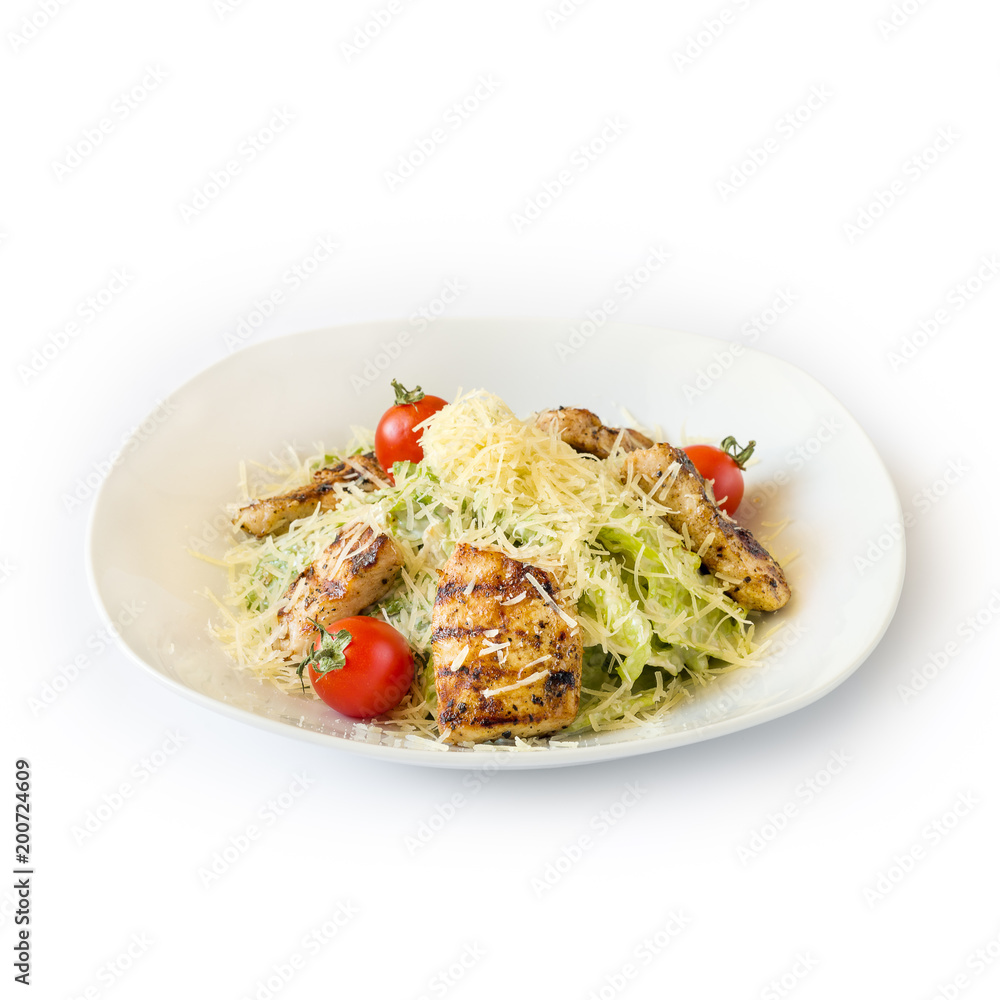 Salad with meat, cheese and herbs on a white plate. Isolated Salad with meat, cheese and herbs on a white plate. Isolated