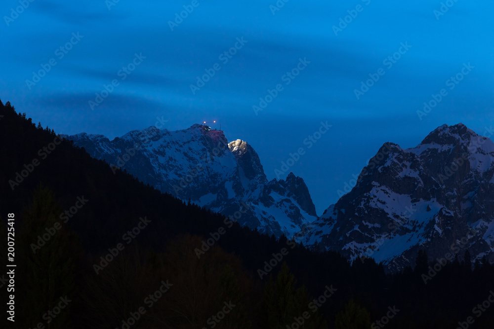 germanys highest mountain zugspitze with the zugspitze building station in the evening