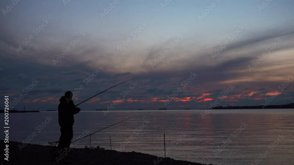 Fisherman catch fish at beautiful evening. Fisherman catch fish at beautiful evening.