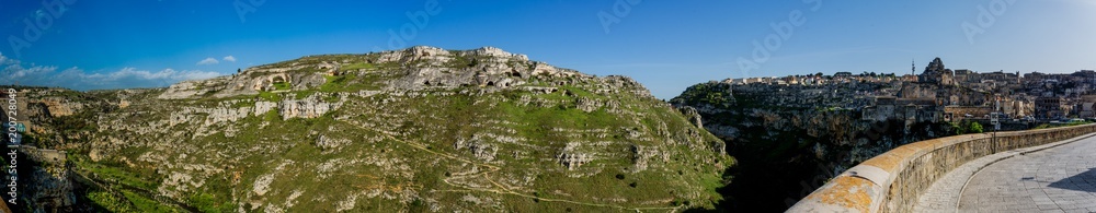 Views of the Caves in the Gravina and Sassi on Blue Sky Background in a Sunny Day. Matera, South of Italy