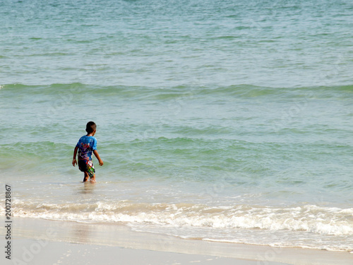 kid playing in the sea