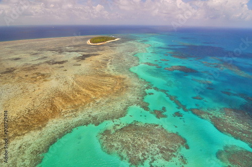 Aerial view of Great Barrier Reef and Green Island from helicopter, Queensland, Australia.
