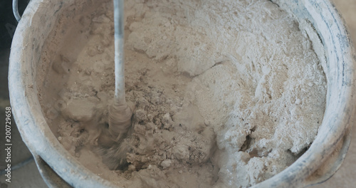 mixing concrete plaster with electric mixer